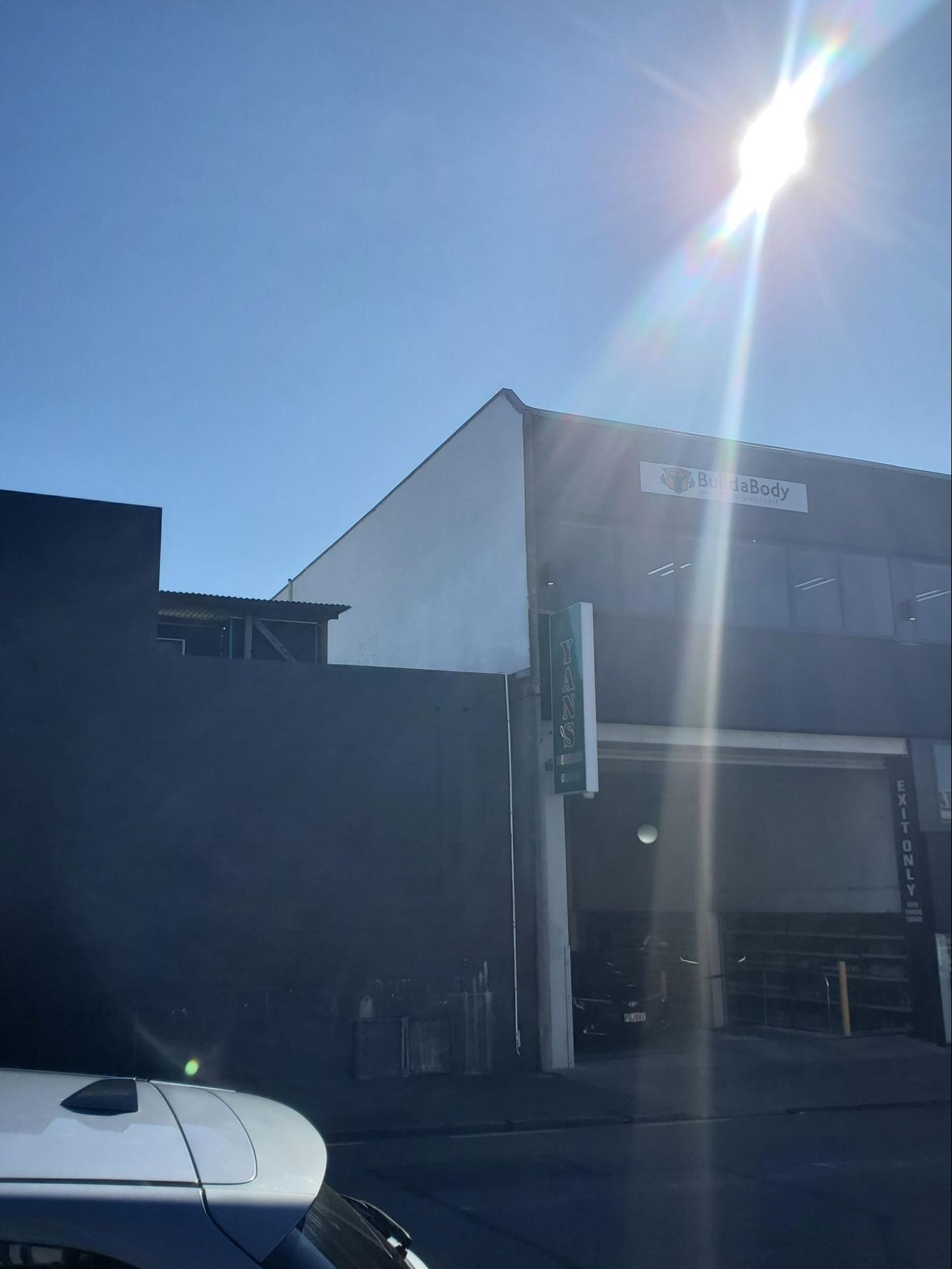 Clean commercial building exterior after water blasting