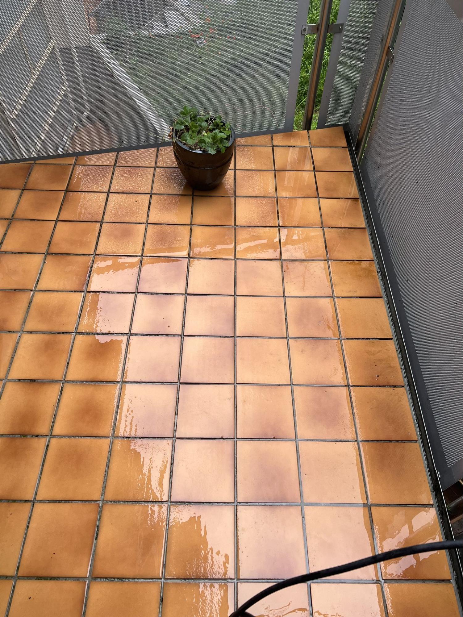 Clean tiled floor after water blasting
