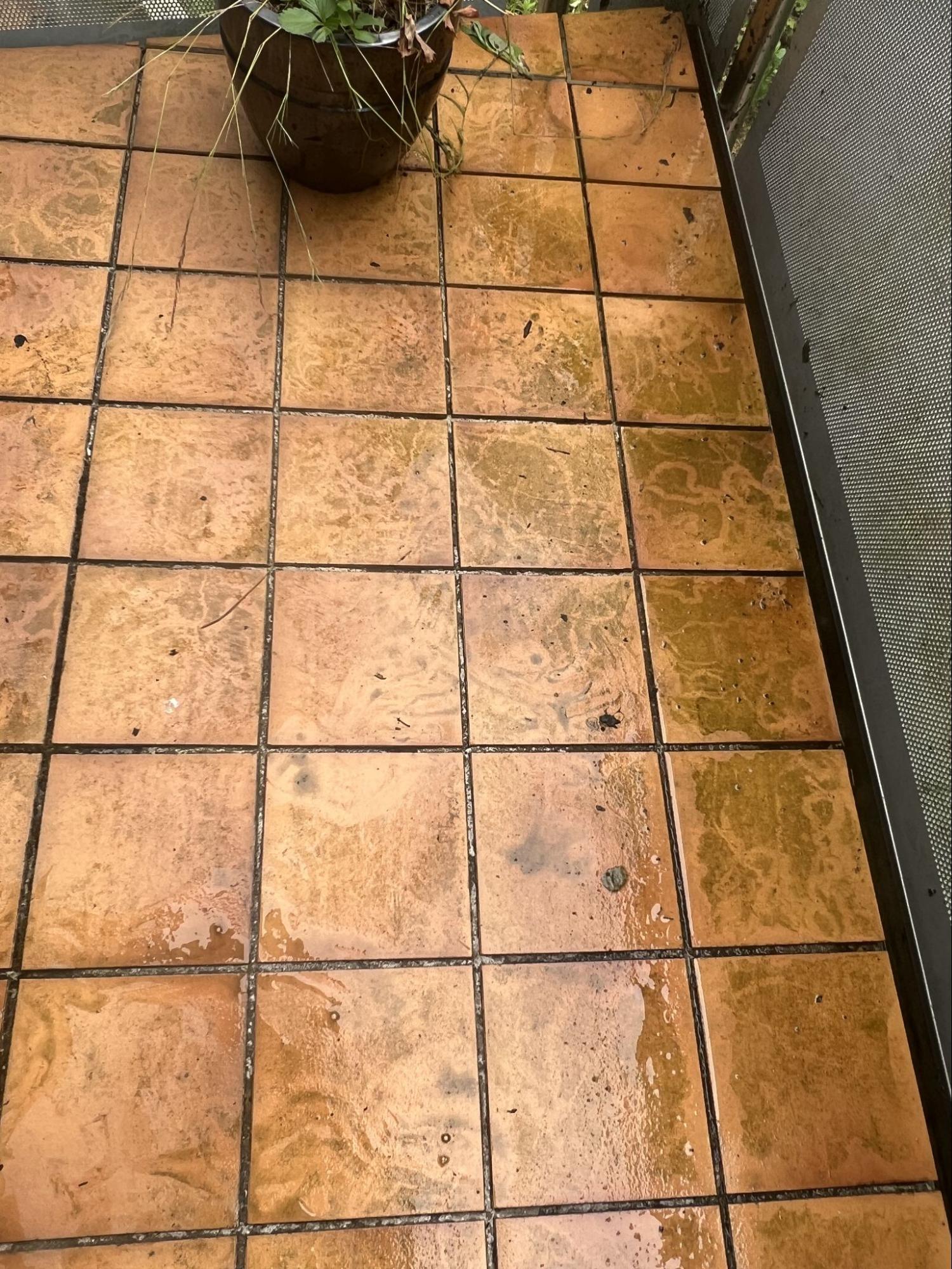 Dirty tiled floor before cleaning