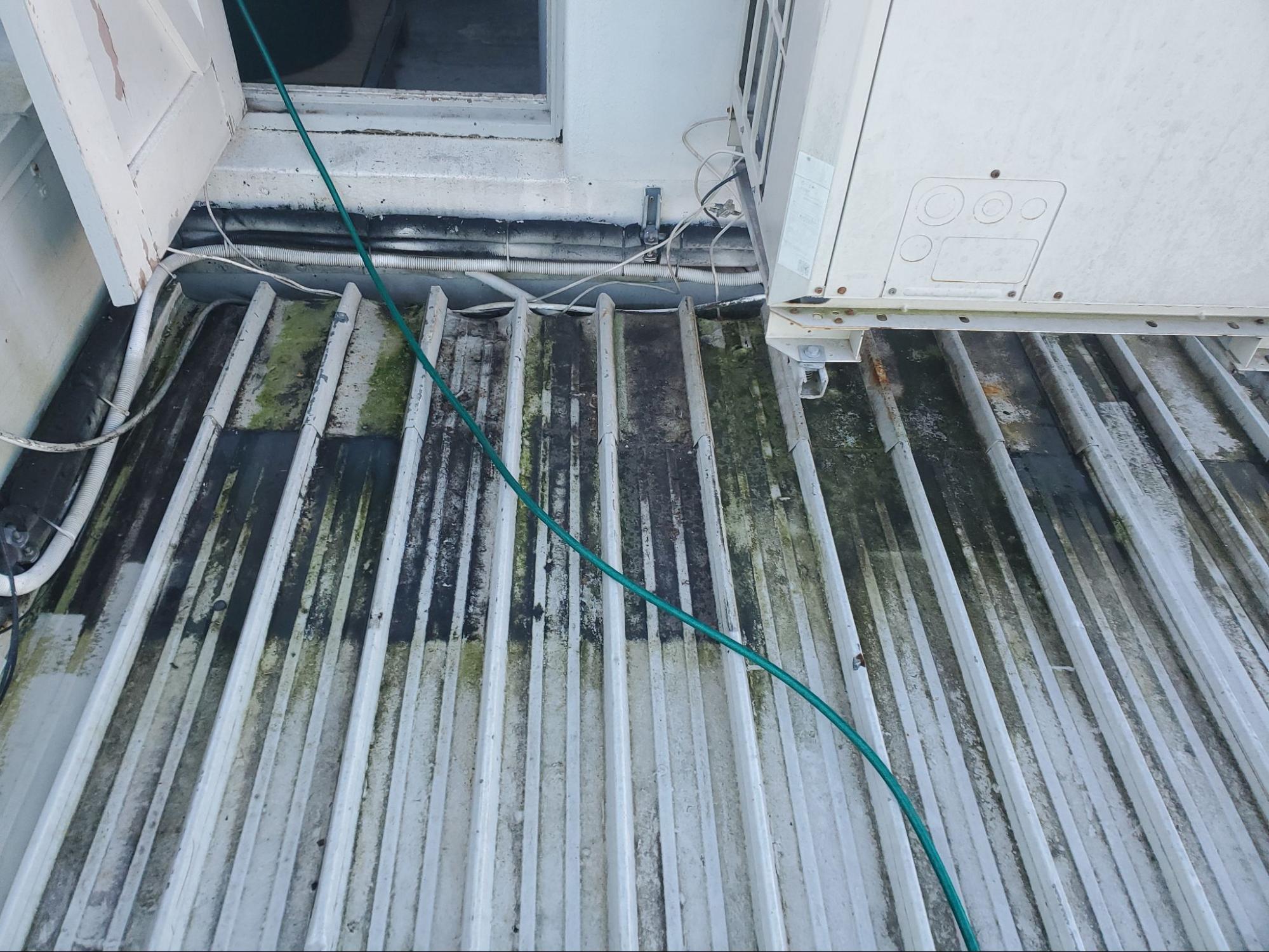 Metal rooftop dirty before water blasting