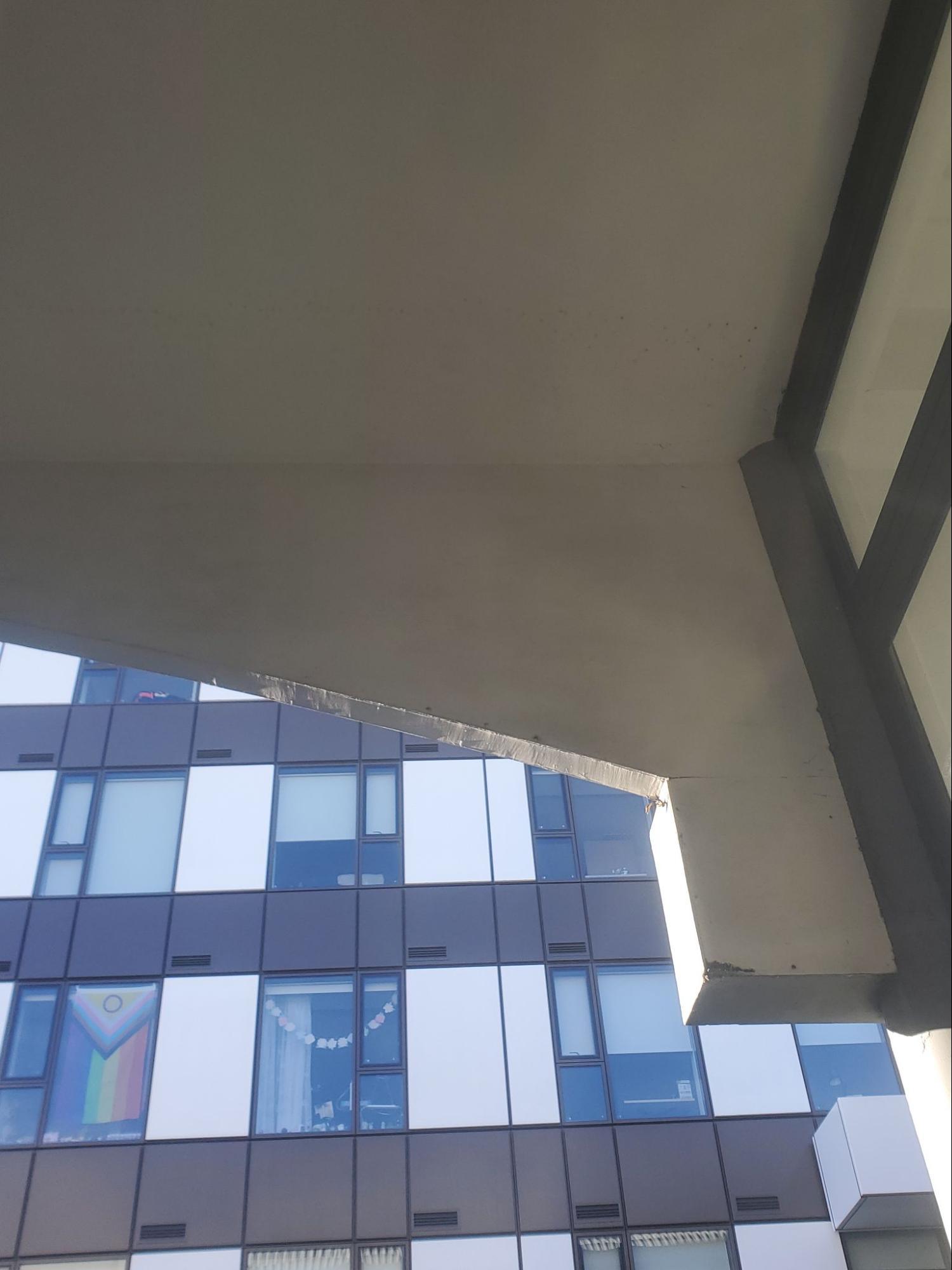 Building balcony underside dirty before cleaning