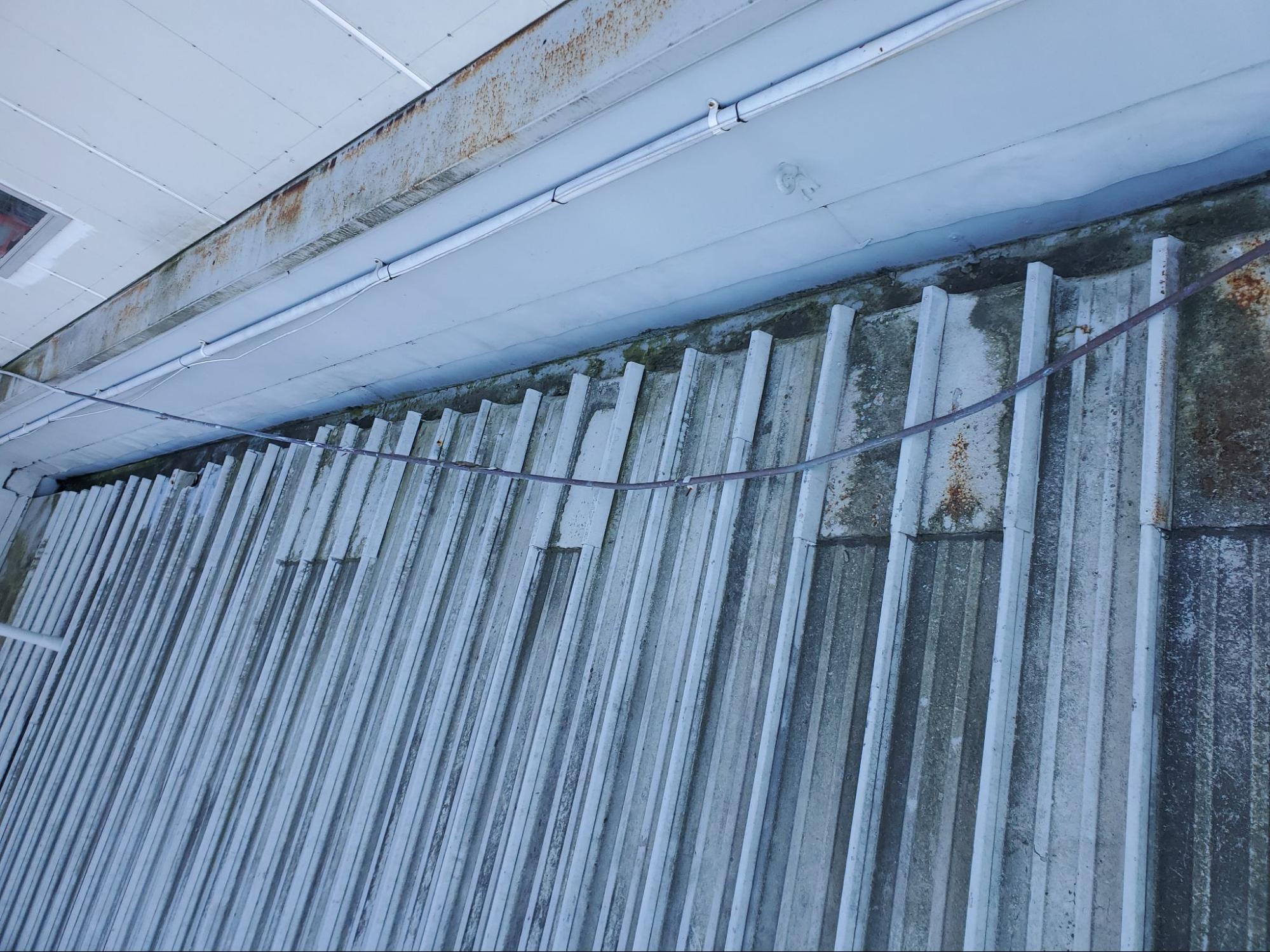 Metal shed roof clean after water blasting