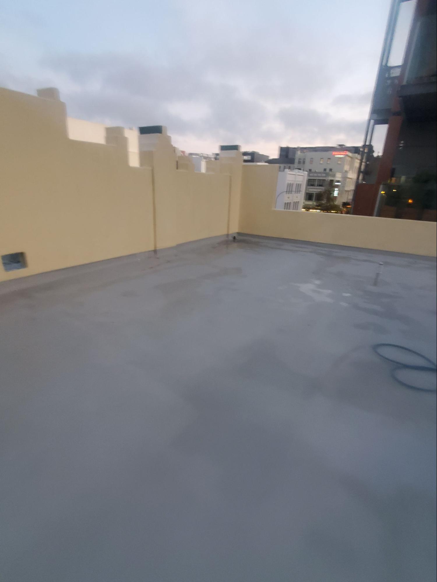 Concrete rooftop clean after water blasting